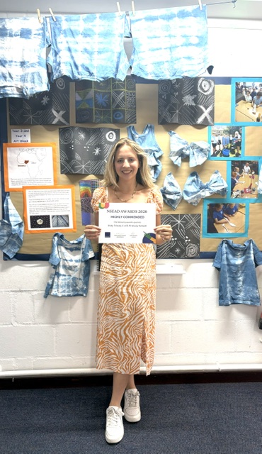 Teacher holding Award